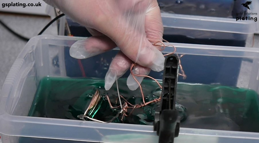 Plastic Star Wars toy inside a nickel plating tank during electroforming 